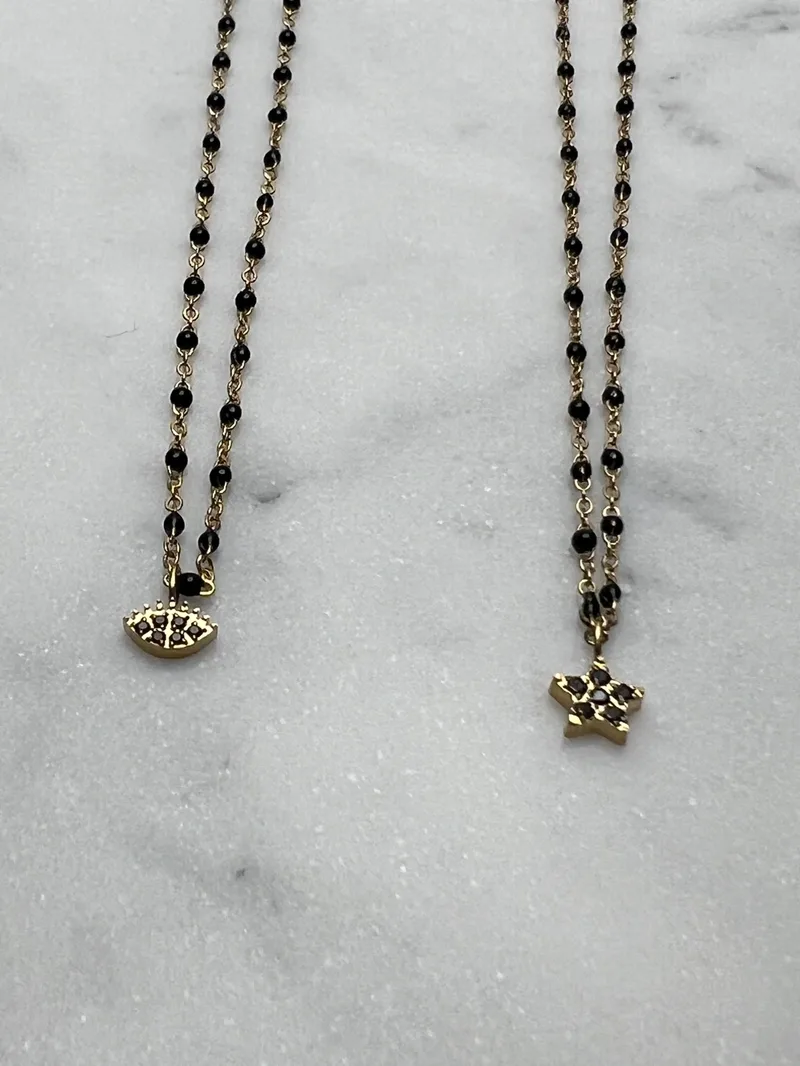 Collier Mona noir (trèfle, croix, oeil, étoile, éclair)